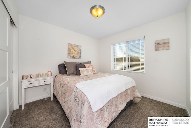 bedroom featuring dark colored carpet