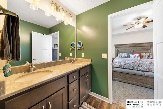 bathroom with ceiling fan and vanity