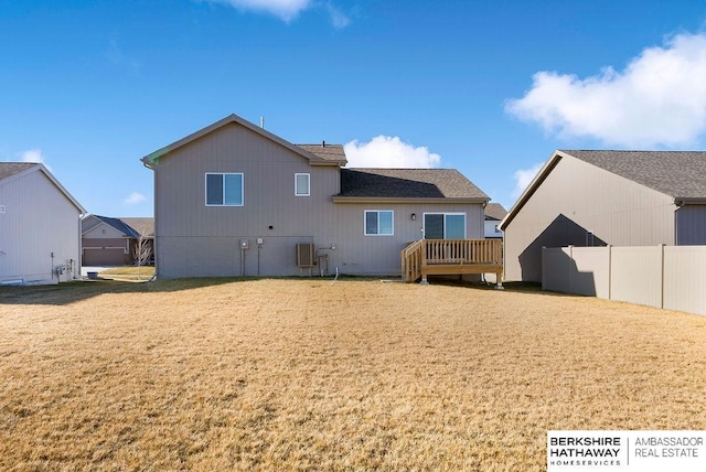 rear view of property with a wooden deck and central AC