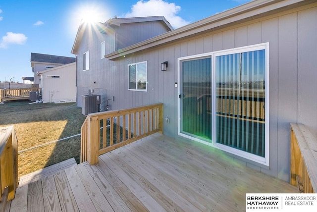 wooden deck featuring central air condition unit