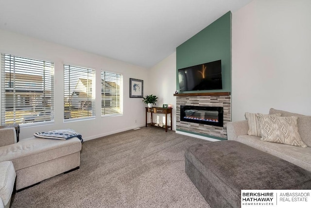 living room featuring carpet flooring, a tile fireplace, and vaulted ceiling