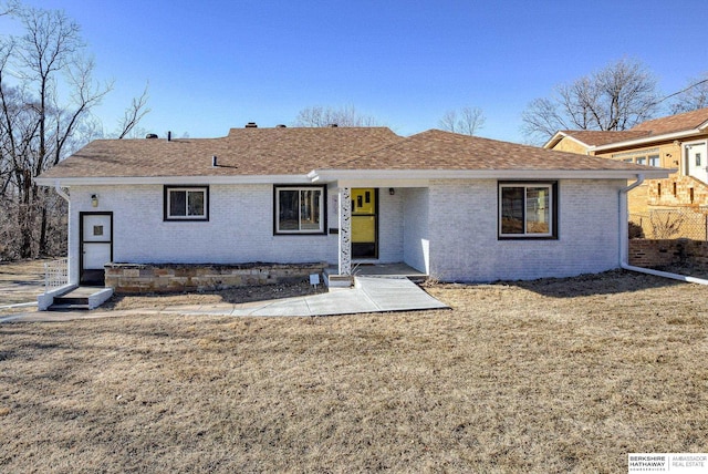 ranch-style home featuring a front yard and a patio area