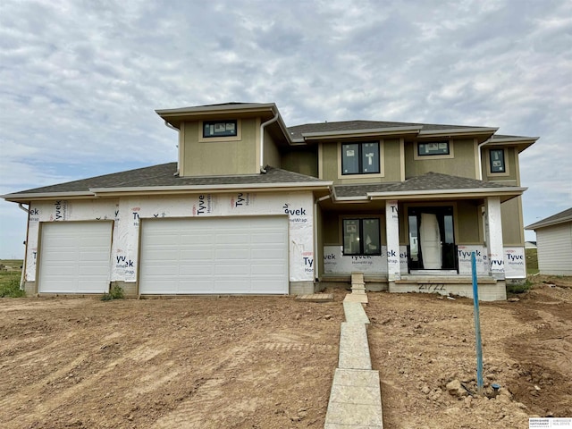 view of front of house with a garage and a porch