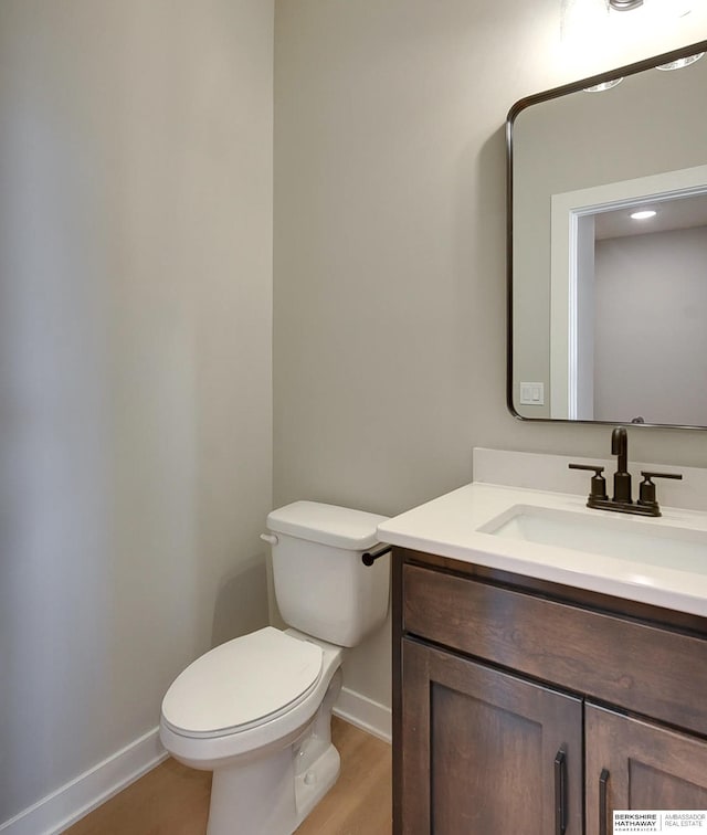 bathroom with toilet and vanity