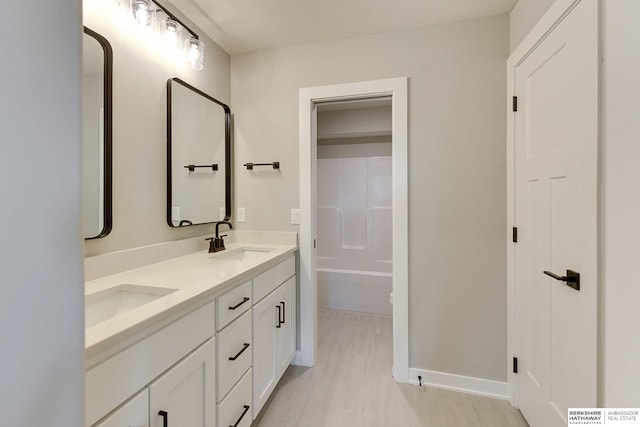 bathroom with vanity and shower / bath combination