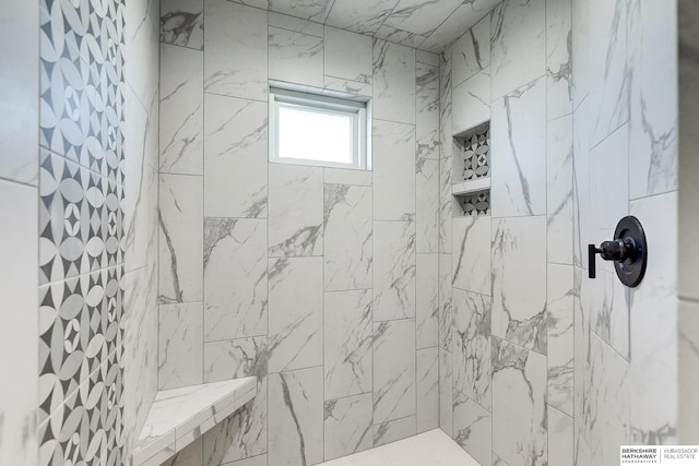 bathroom featuring tiled shower