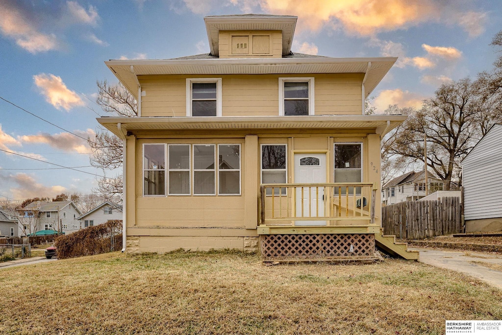 view of front of home with a lawn