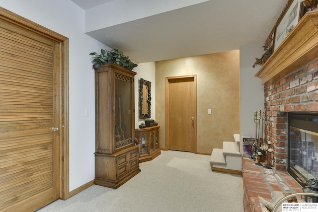 living room featuring light carpet and a brick fireplace