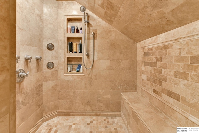 bathroom featuring a tile shower