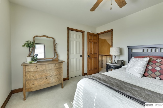 bedroom with ceiling fan and light carpet