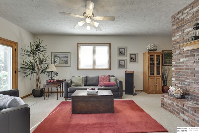 carpeted living room with a textured ceiling and ceiling fan