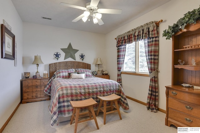 bedroom with light carpet and ceiling fan