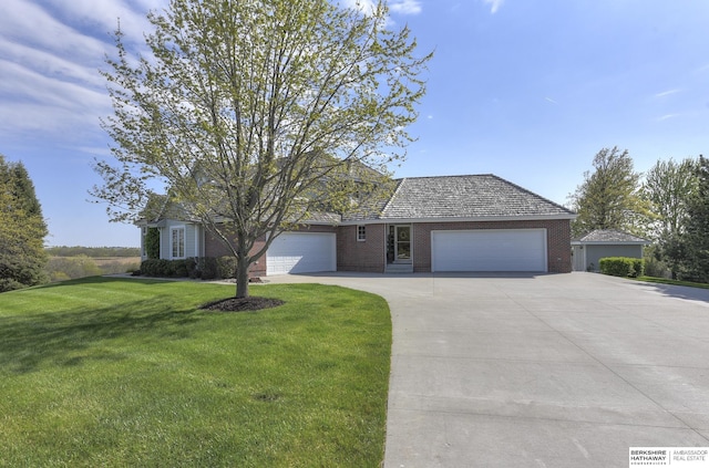 view of front of house featuring a garage and a front yard