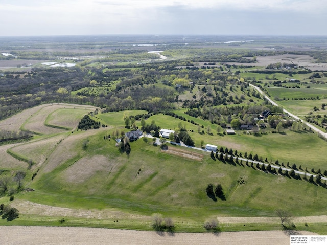 birds eye view of property featuring a rural view