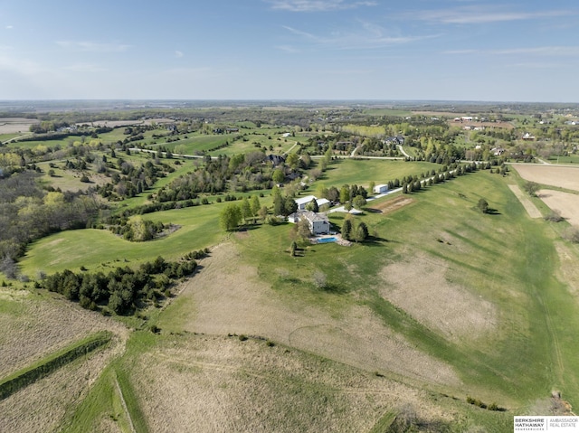 birds eye view of property featuring a rural view