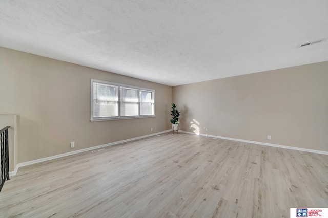 unfurnished living room with light wood-type flooring