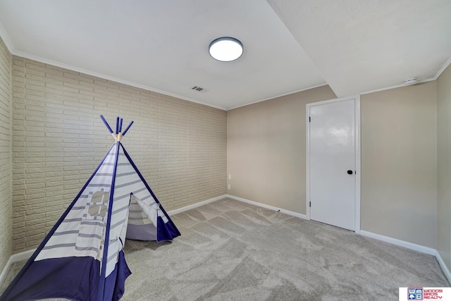 rec room featuring light carpet and ornamental molding