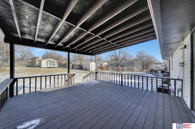 deck featuring a storage shed