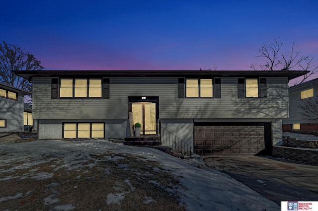 split foyer home featuring a garage