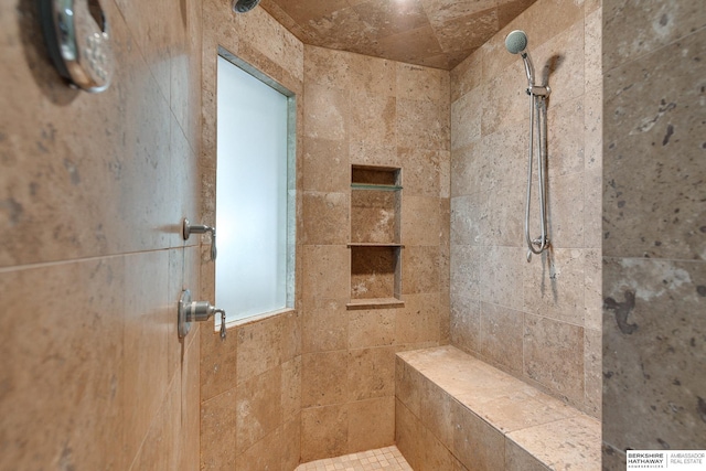 bathroom featuring a tile shower