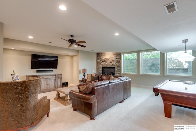 carpeted living room with ceiling fan, a fireplace, and pool table