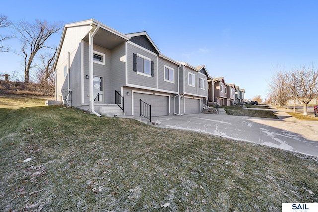 view of front of home featuring a garage and a front yard