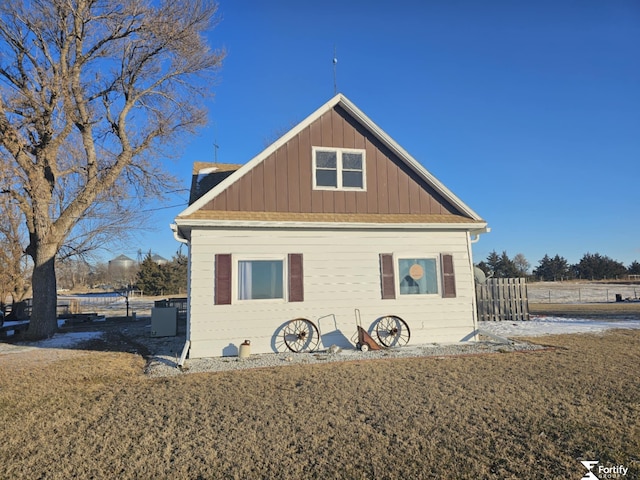 view of side of property with a lawn