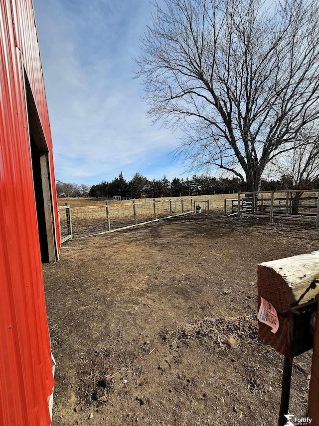 view of yard with a rural view