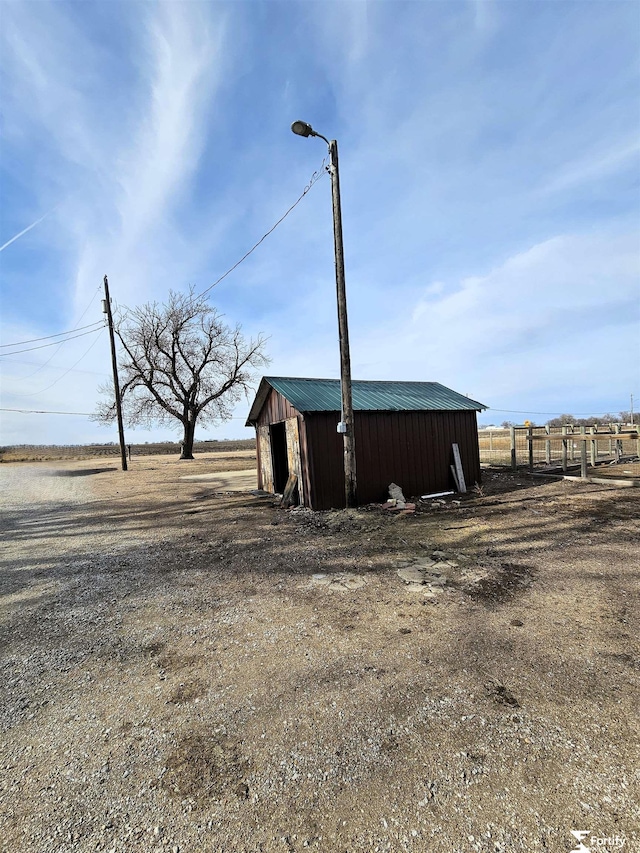 view of outbuilding with a rural view