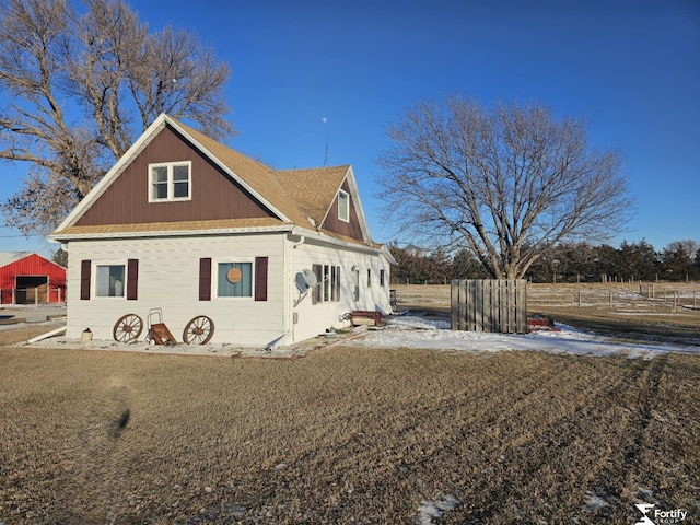 view of snowy exterior featuring a yard