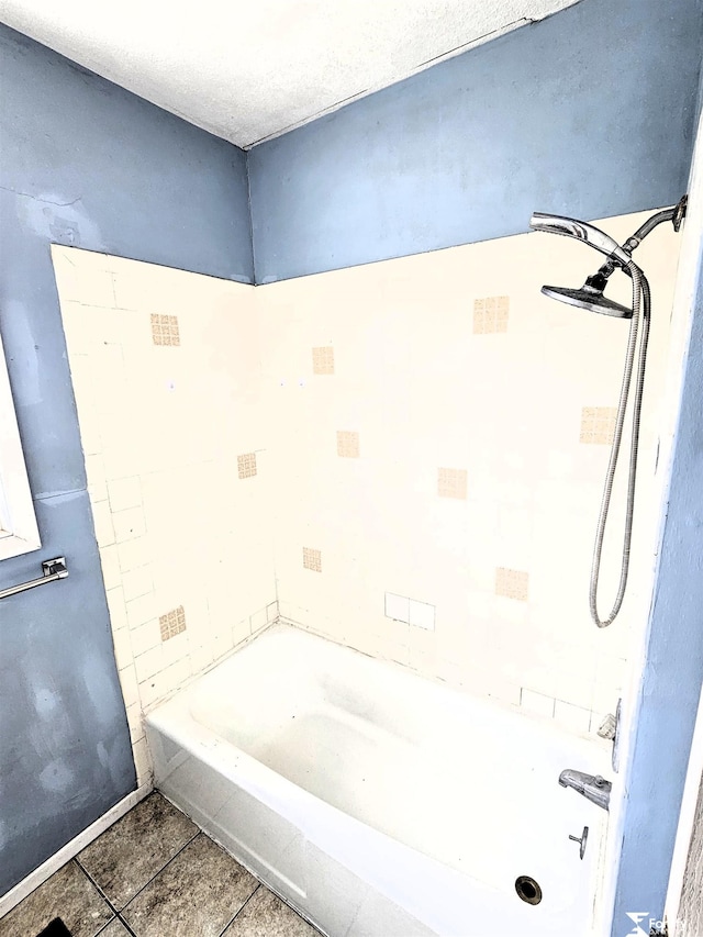 bathroom with tile patterned flooring and a textured ceiling