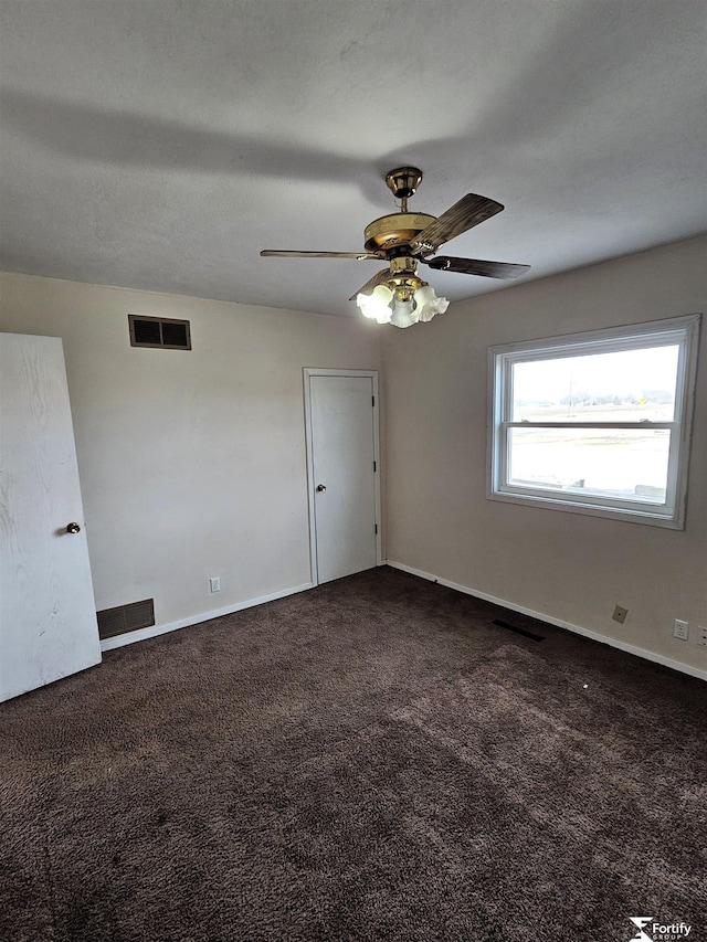 carpeted empty room with ceiling fan