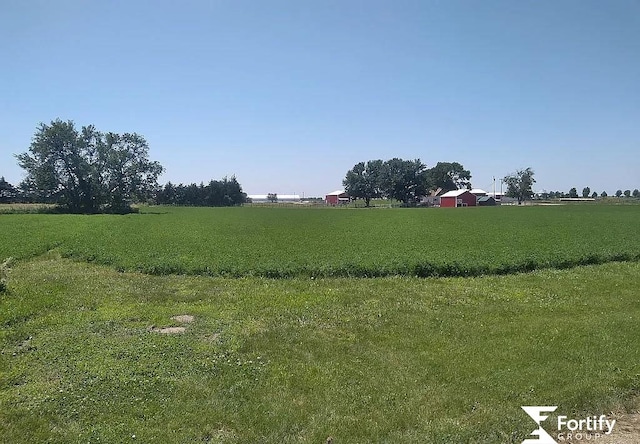 view of yard with a rural view