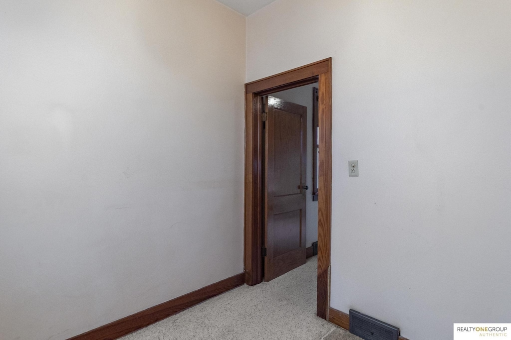 hallway with light carpet