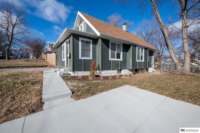 view of front of home with a front yard and a patio area