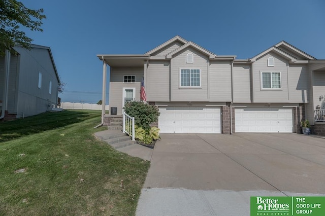 view of front of property with a garage and a front yard