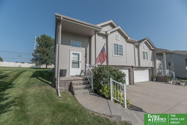 view of front facade with a garage and a front yard