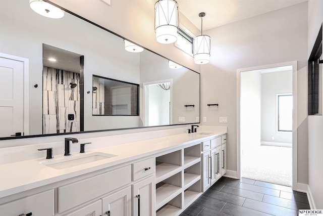 bathroom featuring vanity and a shower