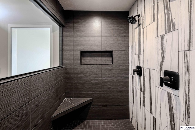 bathroom with a tile shower