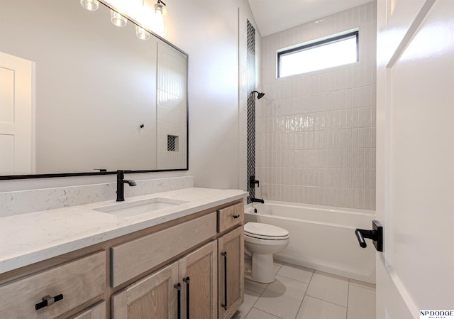 full bathroom featuring toilet, tile patterned flooring, vanity, and tiled shower / bath