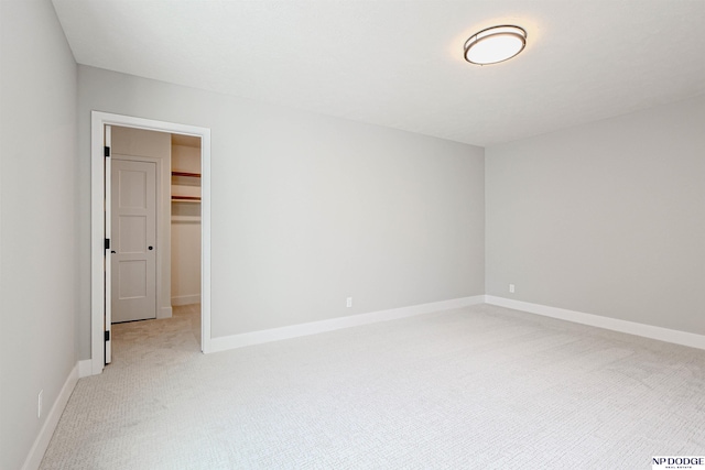 empty room featuring light carpet