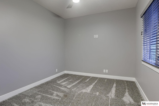 unfurnished room featuring ceiling fan, carpet floors, and baseboards