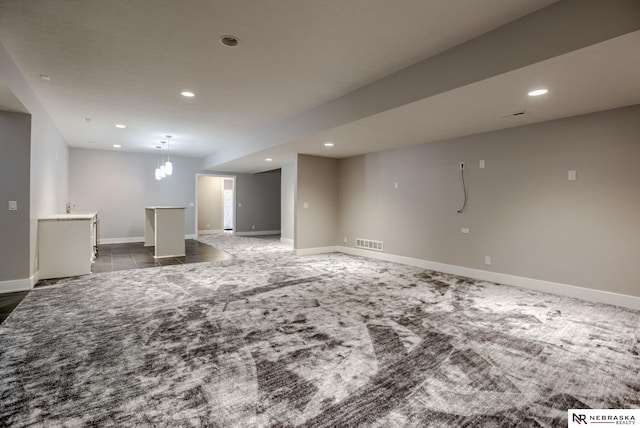 interior space featuring recessed lighting, visible vents, and baseboards