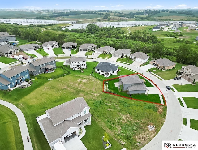 birds eye view of property featuring a water view