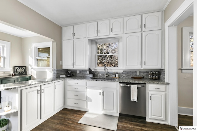 kitchen with dishwasher, light stone countertops, dark hardwood / wood-style floors, white cabinets, and sink