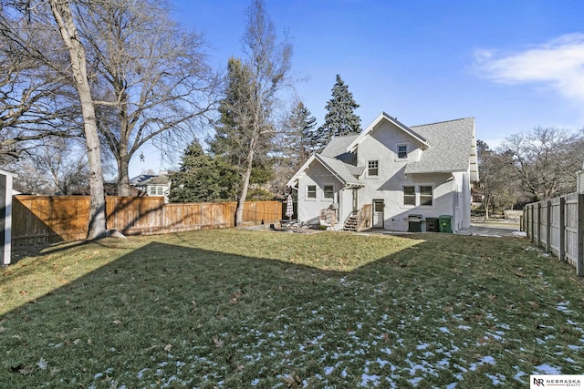 back of house featuring a yard