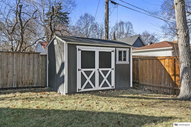 view of outdoor structure featuring a lawn