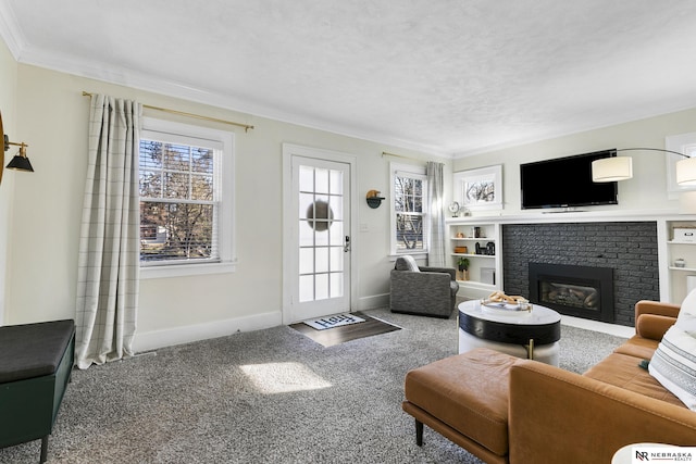 carpeted living room featuring a brick fireplace and ornamental molding