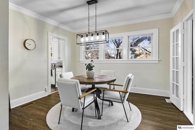 dining room with ornamental molding and dark wood-type flooring