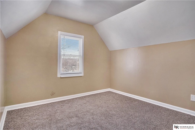 bonus room with carpet flooring and lofted ceiling